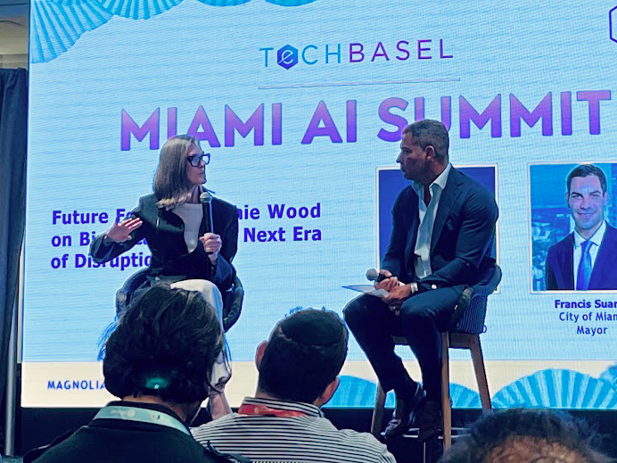 Cathie Wood ARK Invest presentation on disruptive innovation, AI, and St. Petersburg Florida headquarters relocation at Tech Basel Miami