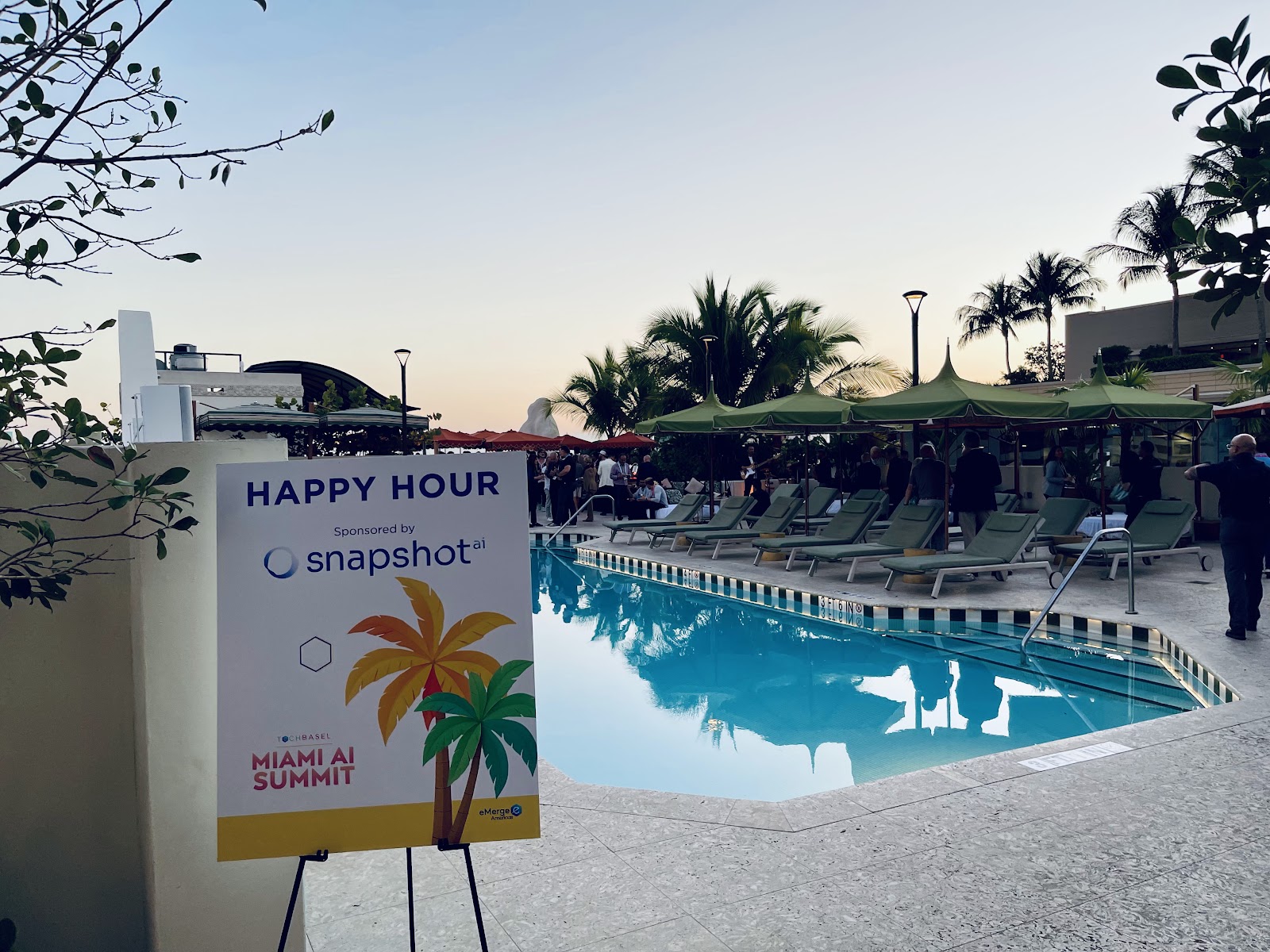 AIVO team and Tech Basel Miami attendees networking at the official happy hour during eMerge Americas Innovation Week in Florida's AI ecosystem